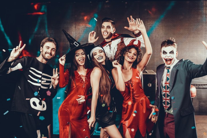 a group of people standing on a stage posing for the camera